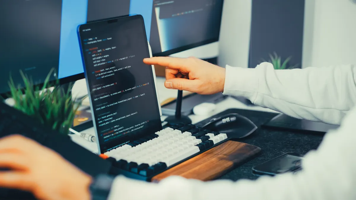 Agentic SEO automation systems — The Complete Guide Agentic SEO automation systems — The Complete Guide — Close-up of Programmer Typing Code on Laptop