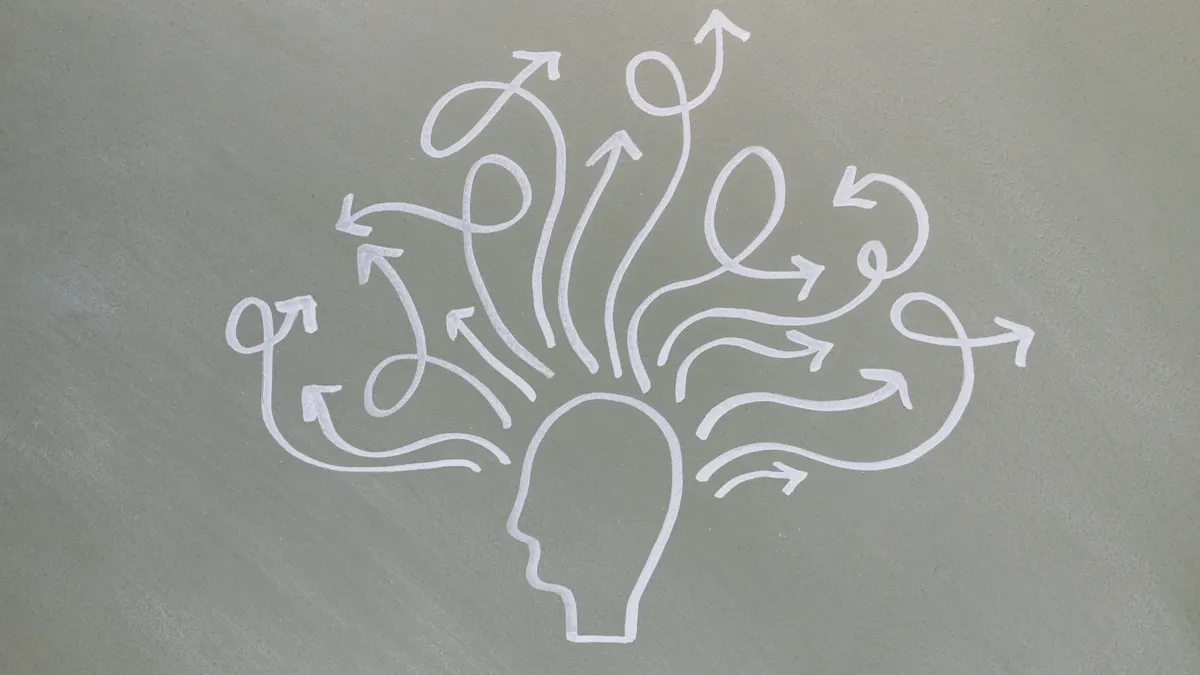 head with branching arrows symbolizing routing choices